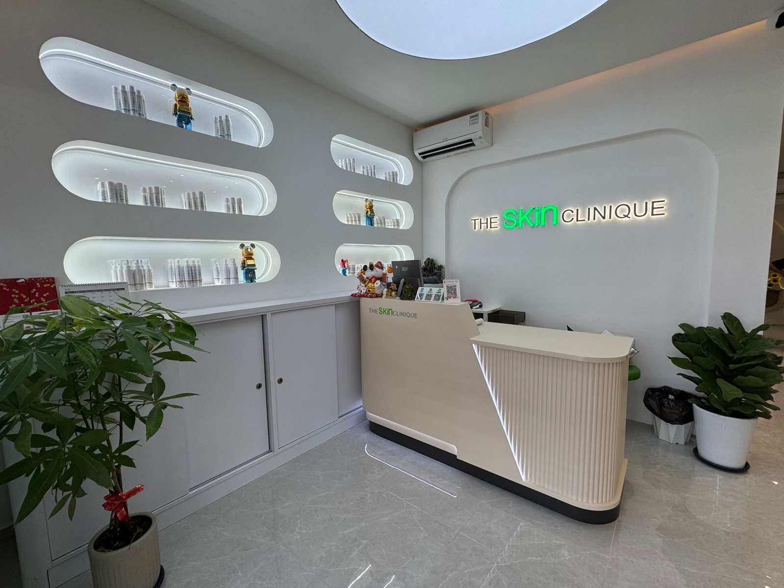 The reception desk with the shop logo behind it